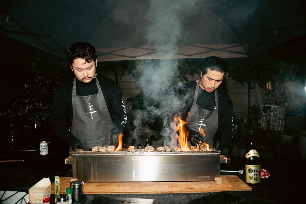 Yakitori grilling over fire
